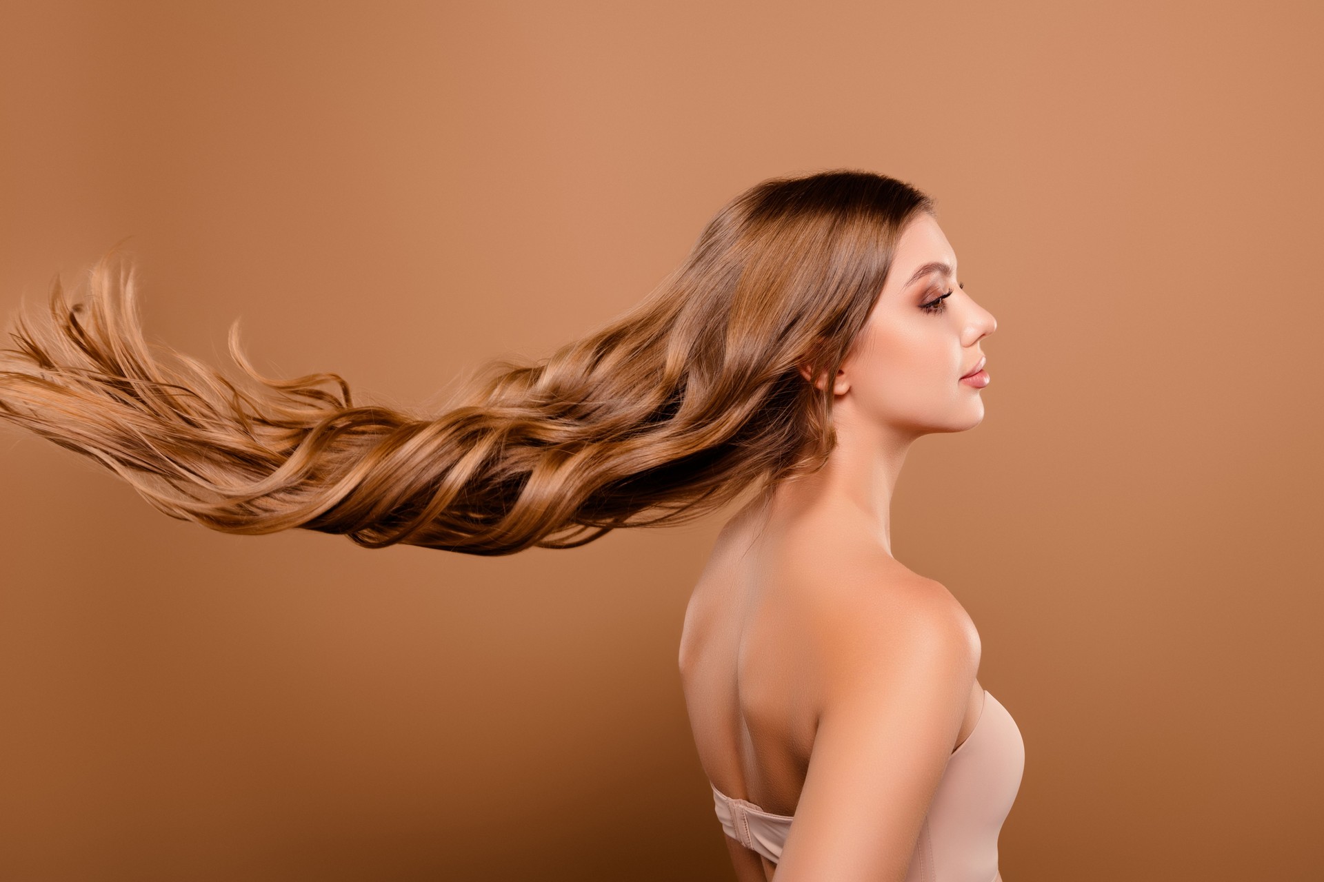 Photo of stunning charming lovely girl long healthy hair isolated on beige color background