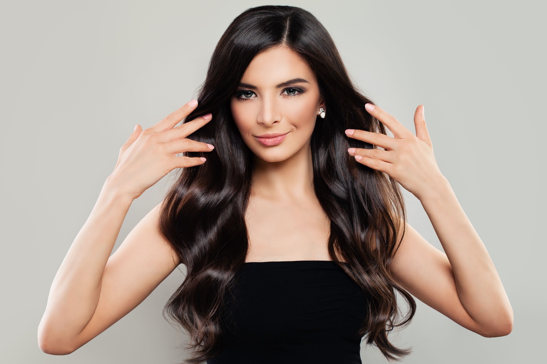 Healthy Woman with Long Wavy Hair. Haircare Concept